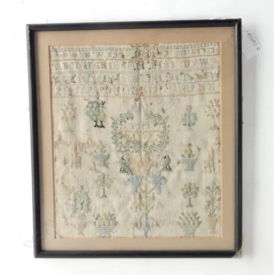 A framed antique alphabet German sampler c.1807  230 x 265mm, some damage and fading...